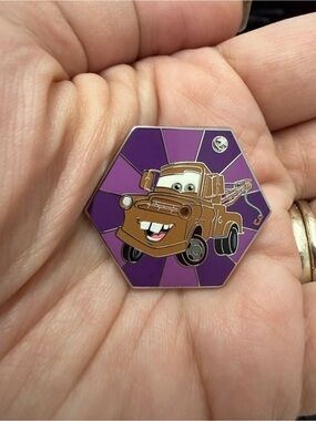 Disney Brown Tow Mater Enamel Pin on Purple Background